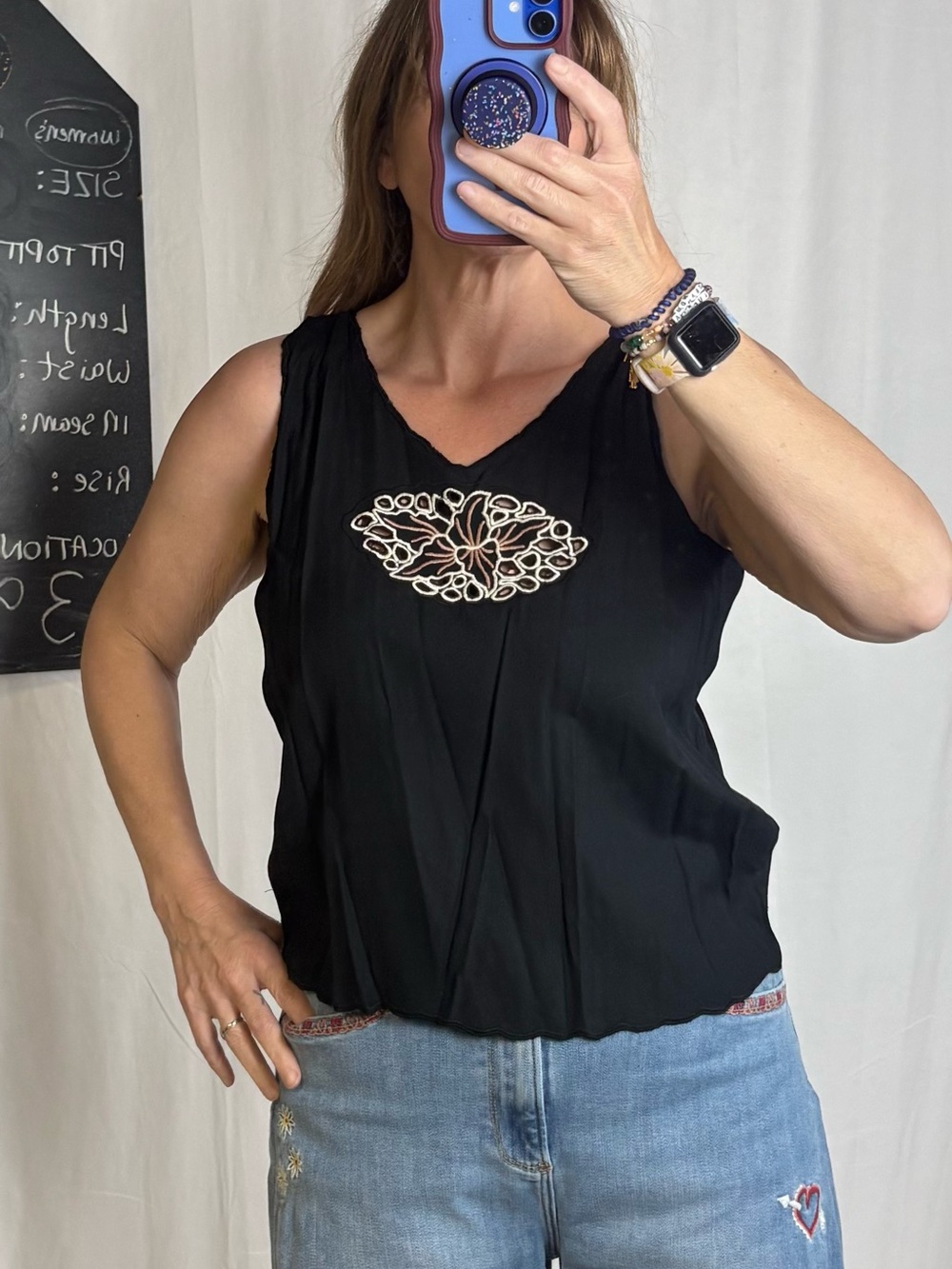 Black Sleeveless Tank with Decorative Cutout Accent